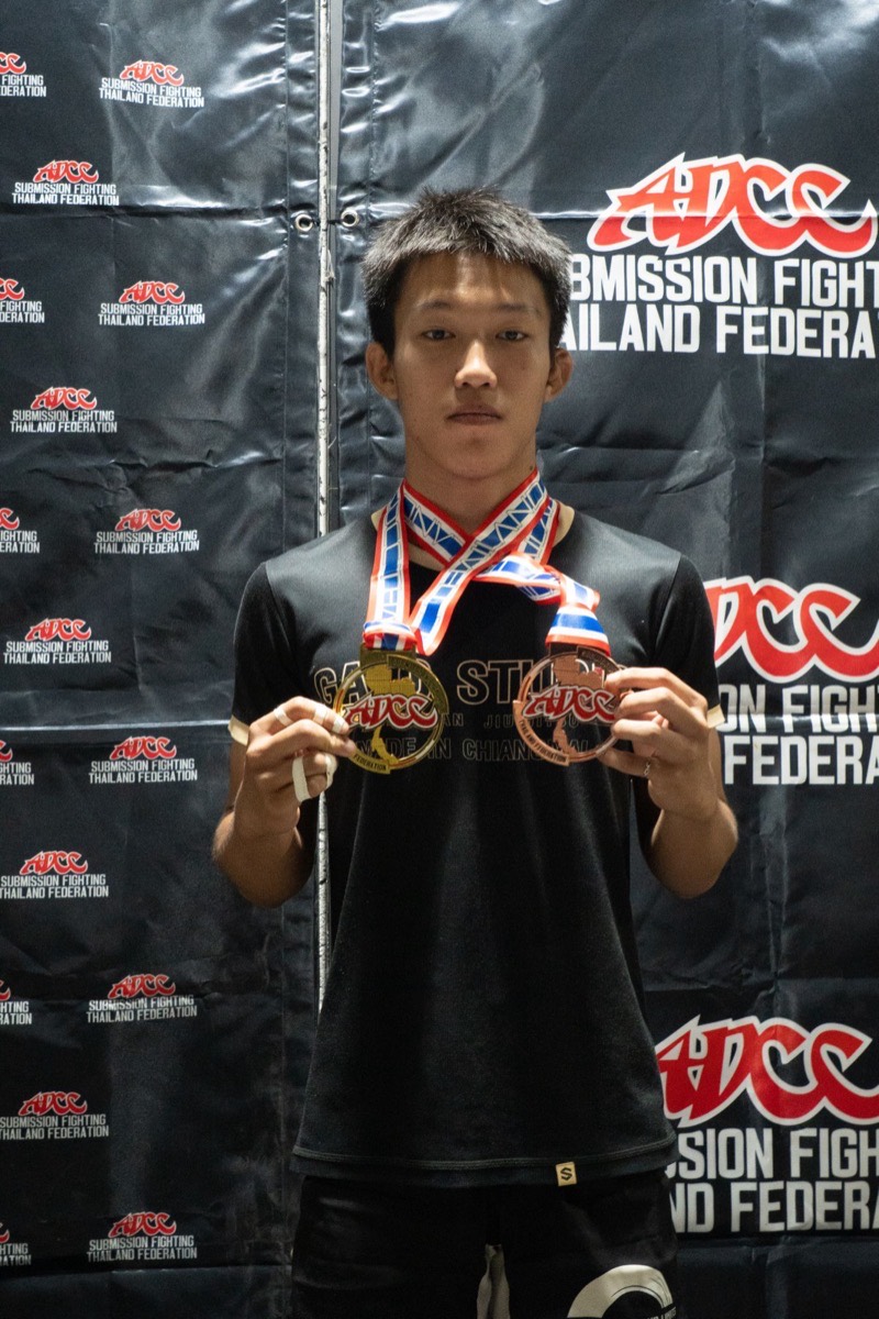 A Gato Studio BJJ competitor with gold and bronze medals at an ADCC Submission Fighting Thailand Federation event