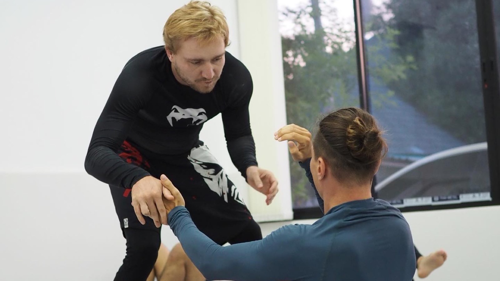Visiting students training Brazilian Jiu-Jitsu during a drop-in session at Gato Studio BJJ in Chiang Mai