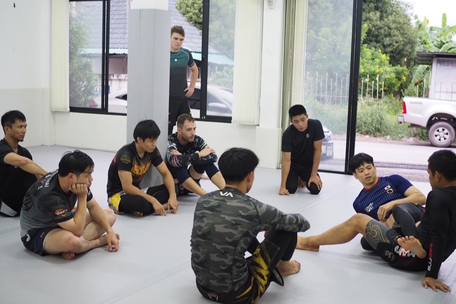 The glass frontage of Gato Studio BJJ looking out onto the street in Chiang Mai